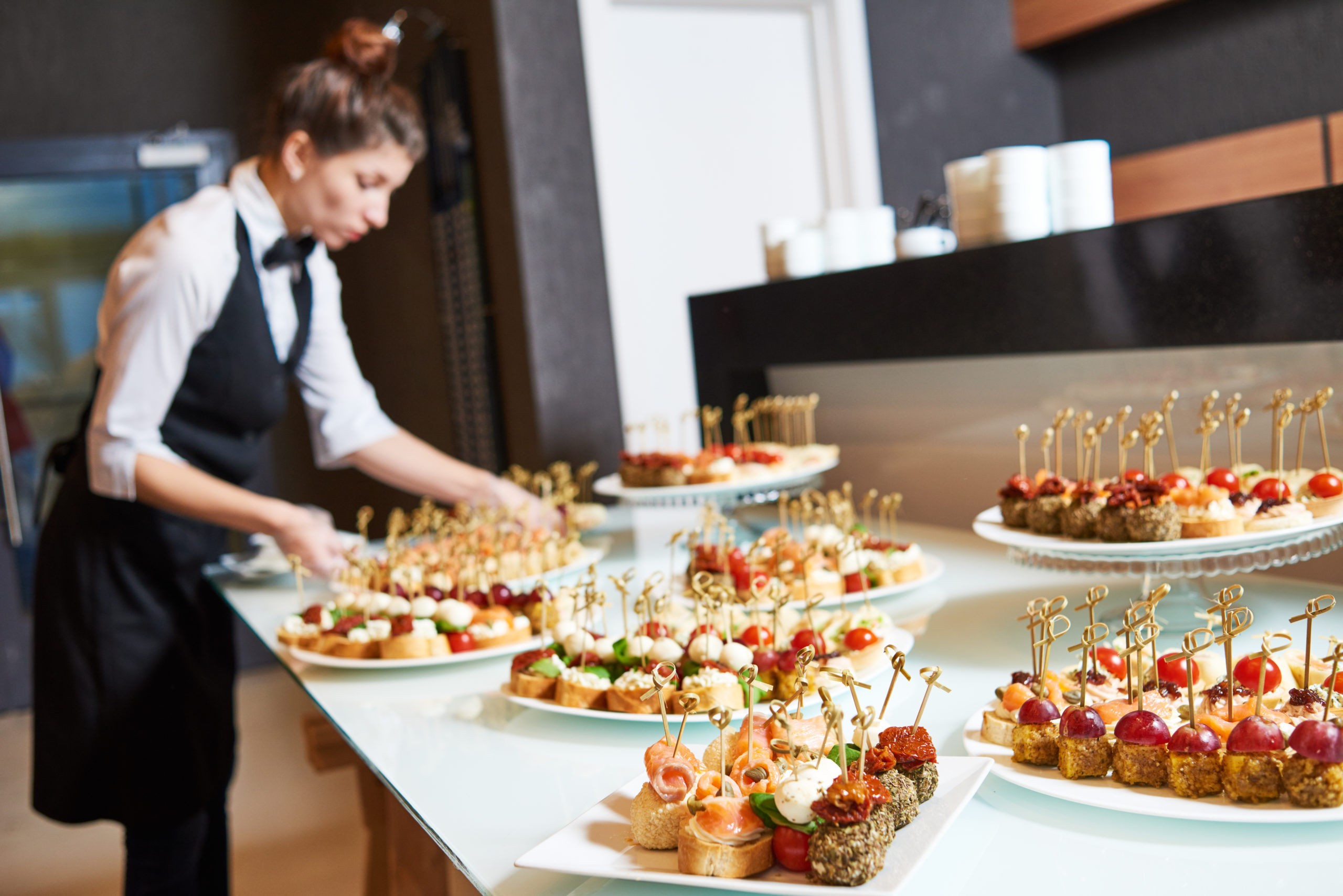 Restaurant waitress serving table with food Girl Friday Berks housekeeping cleaning services Party help
