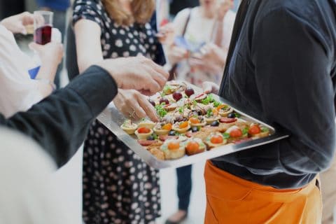 waiter doing catering service at social gathering, Girl Friday Berks housekeeping cleaning services
